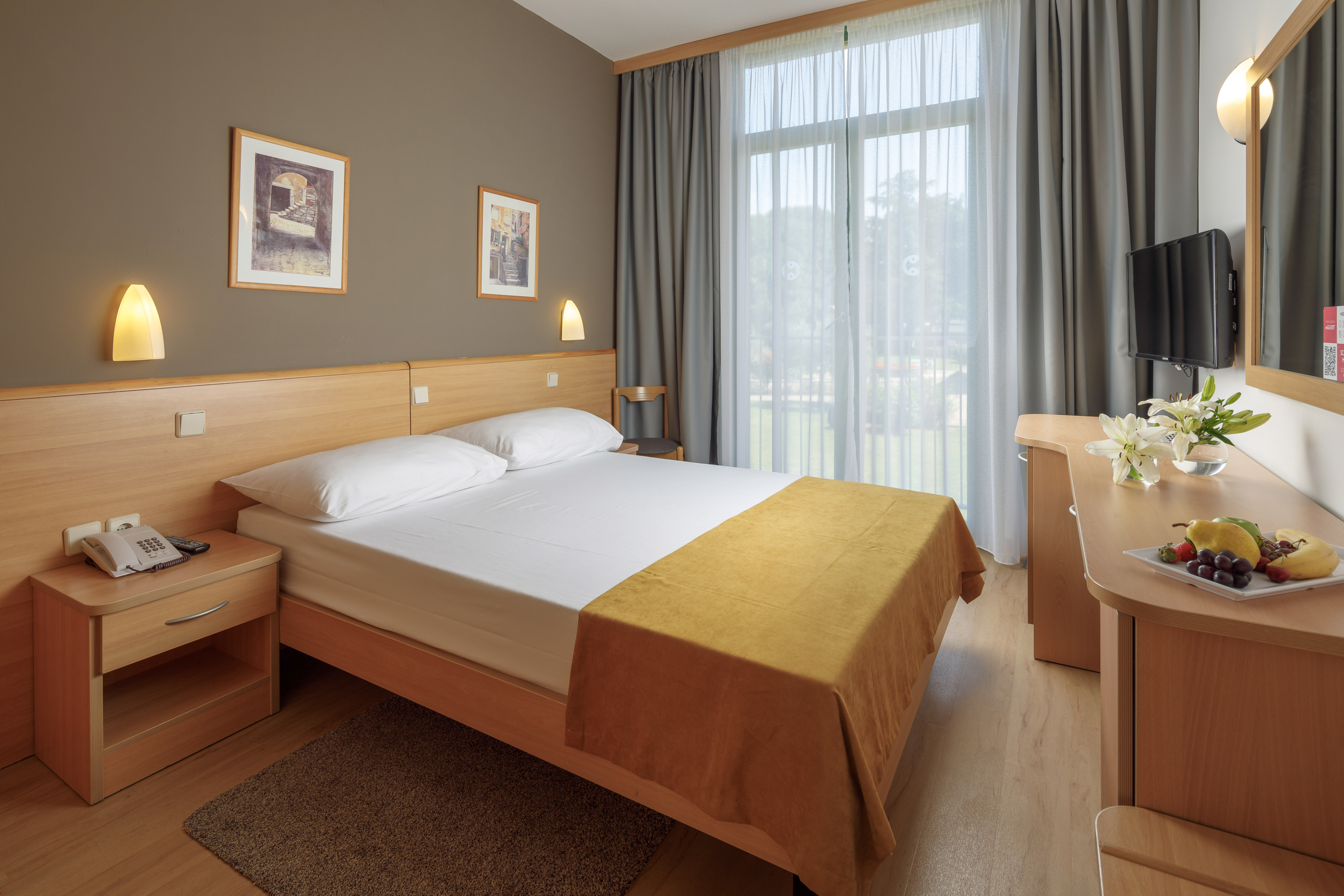 a bedroom with a bed and a desk