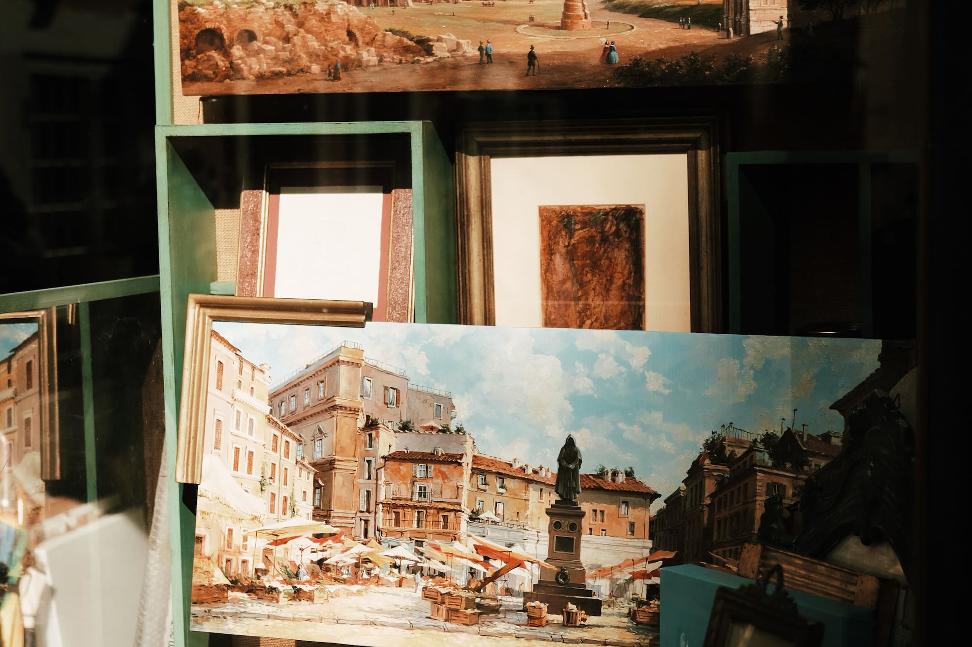 a group of pictures on a shelf