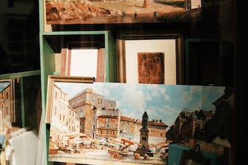 a group of pictures on a shelf