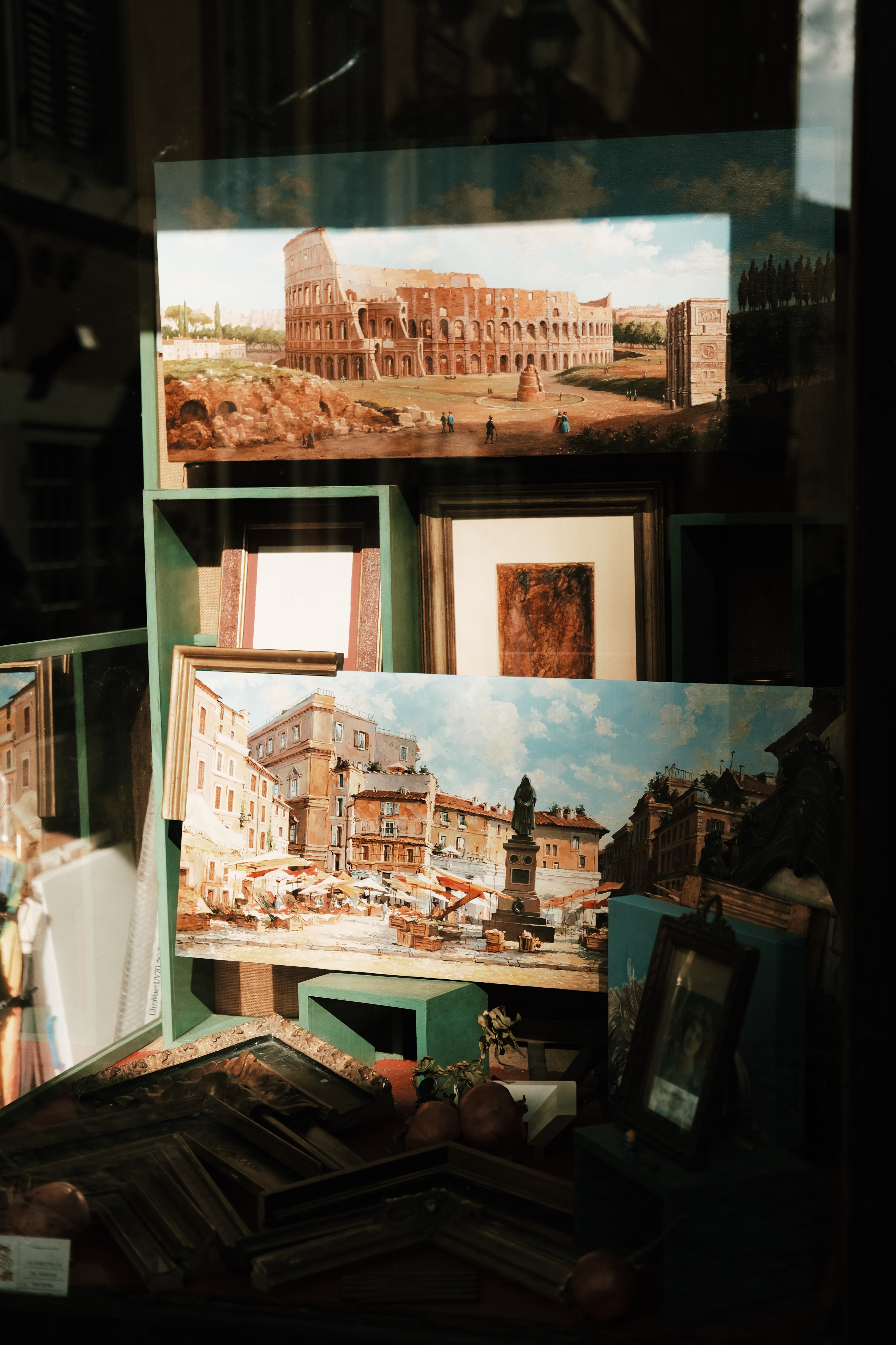a group of pictures on a shelf