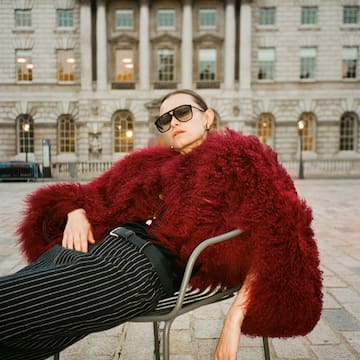 a woman sitting on a chair