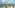 Tropical luxury resort with lagoon pools, palm trees, hotel buildings, ocean.