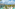 Tropical luxury resort with lagoon pools, palm trees, hotel buildings, ocean.