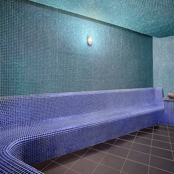 a blue tiled bench in a room