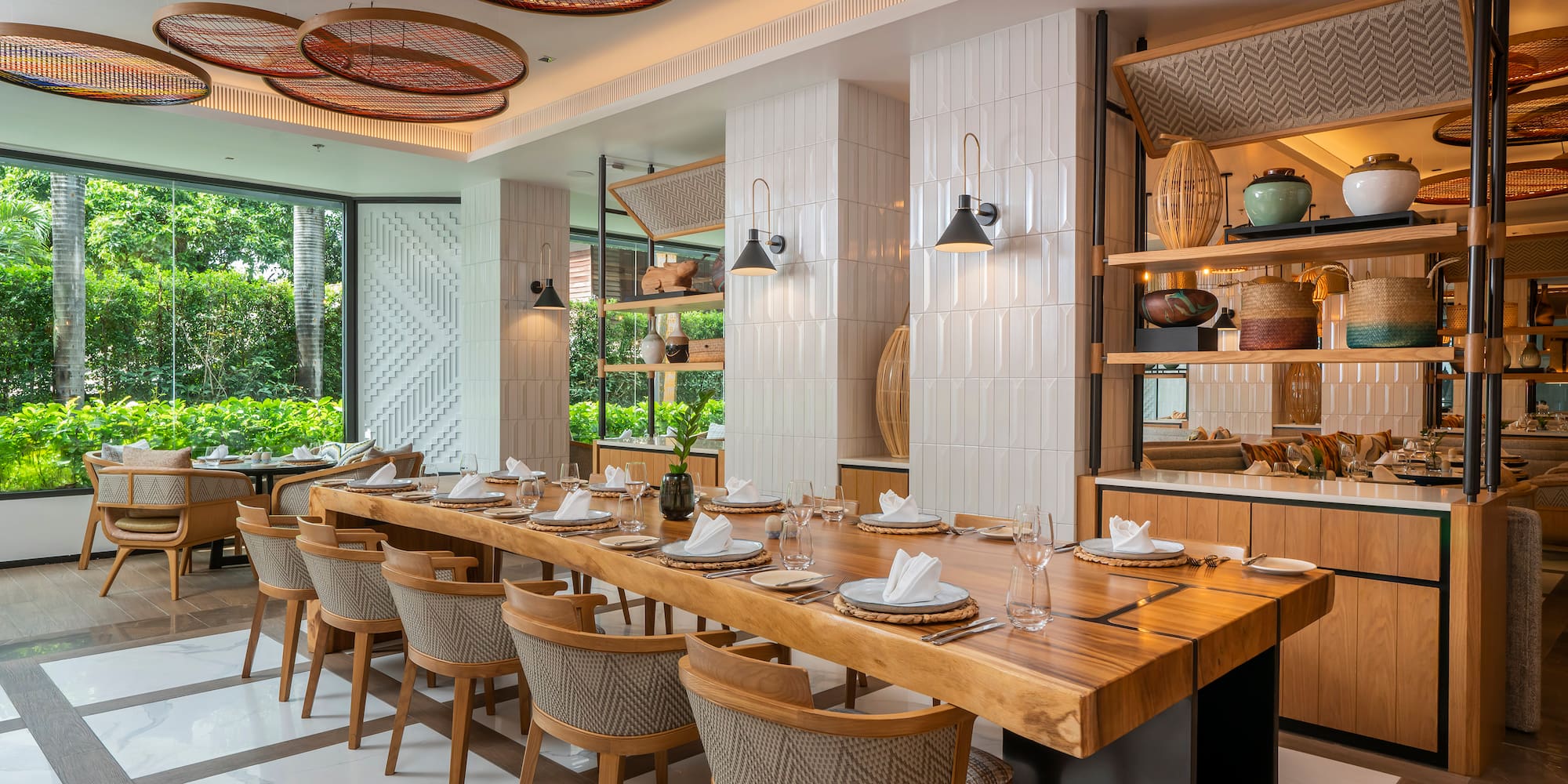 a large dining room with a long table and chairs