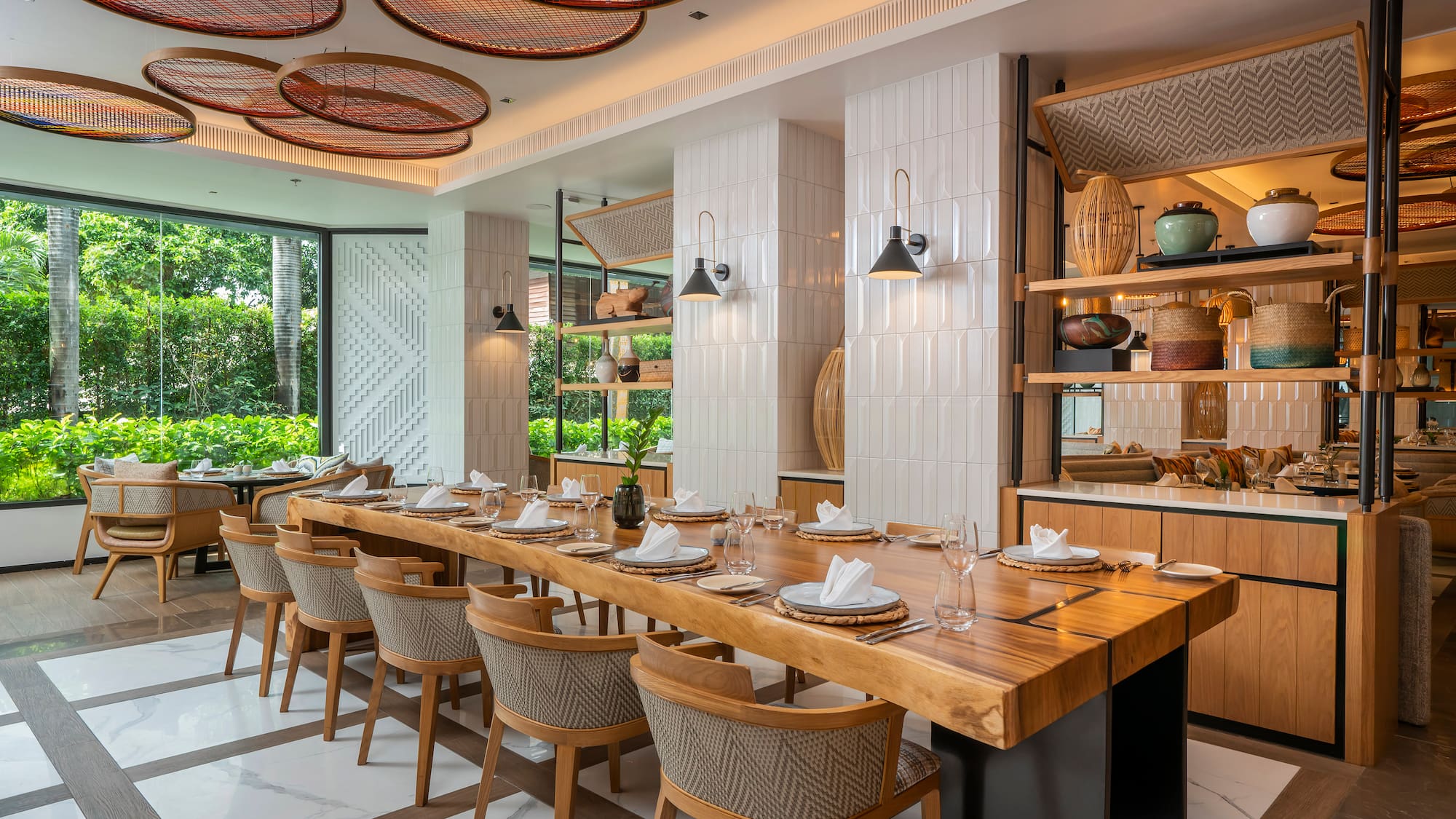 a large dining room with a long table and chairs