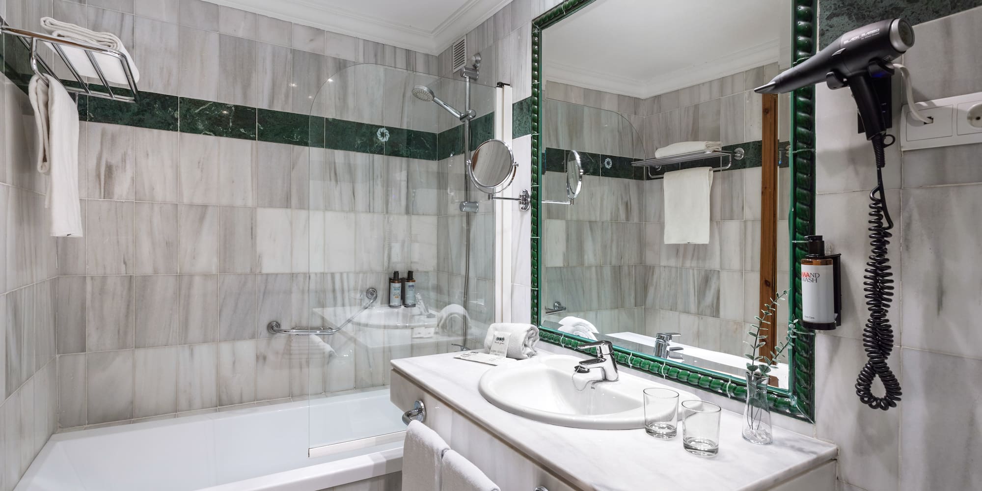 a bathroom with a mirror and a bathtub