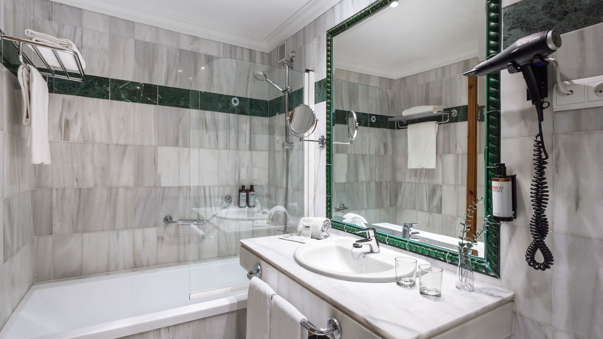 a bathroom with a mirror and a bathtub