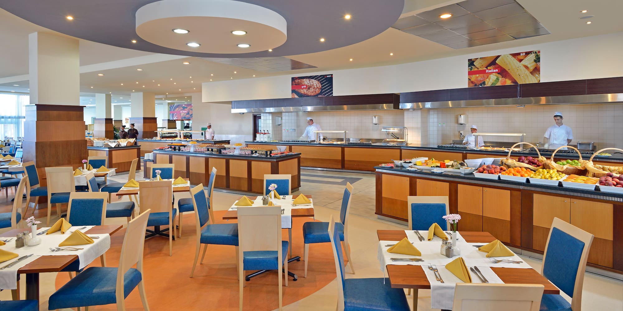 a restaurant with many tables and chairs