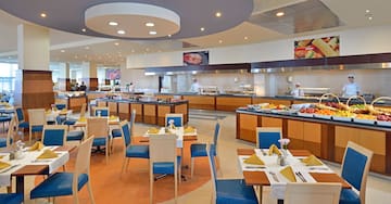 a restaurant with many tables and chairs