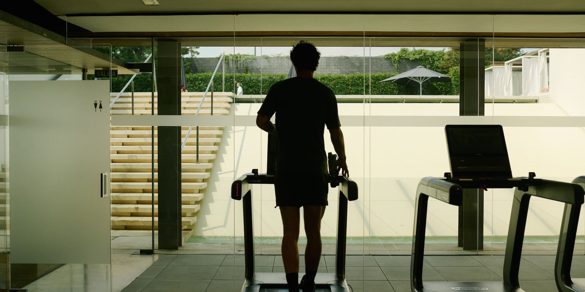 a man on a treadmill in a gym
