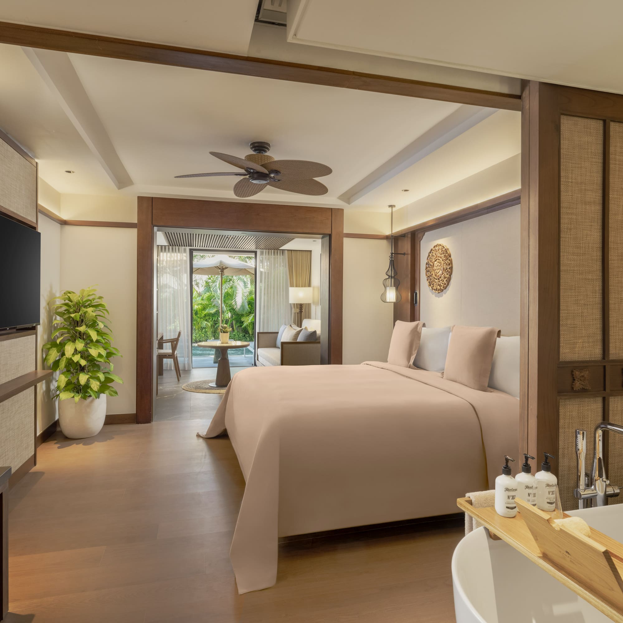 a bedroom with a television and a bed