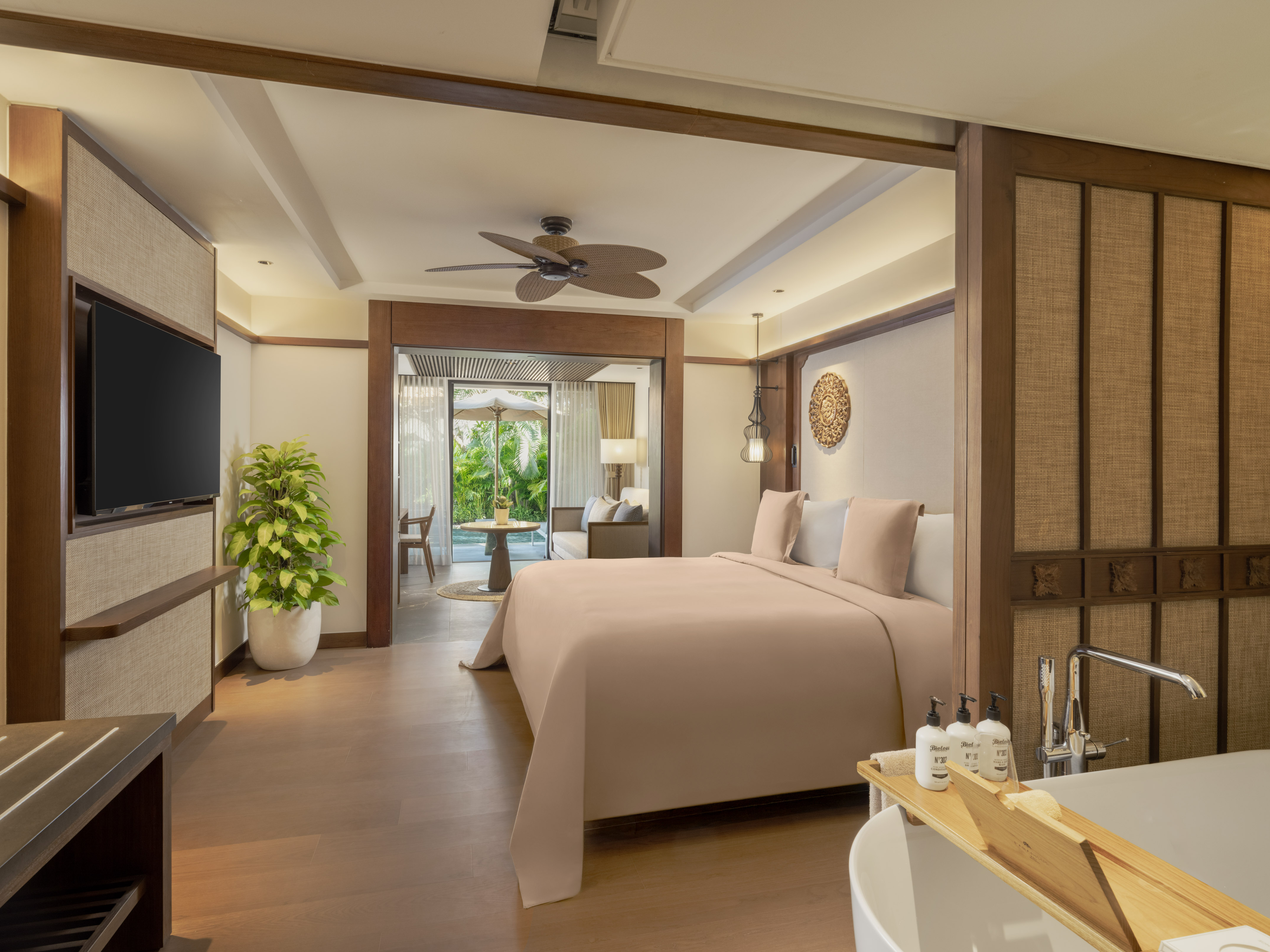 a bedroom with a television and a bed