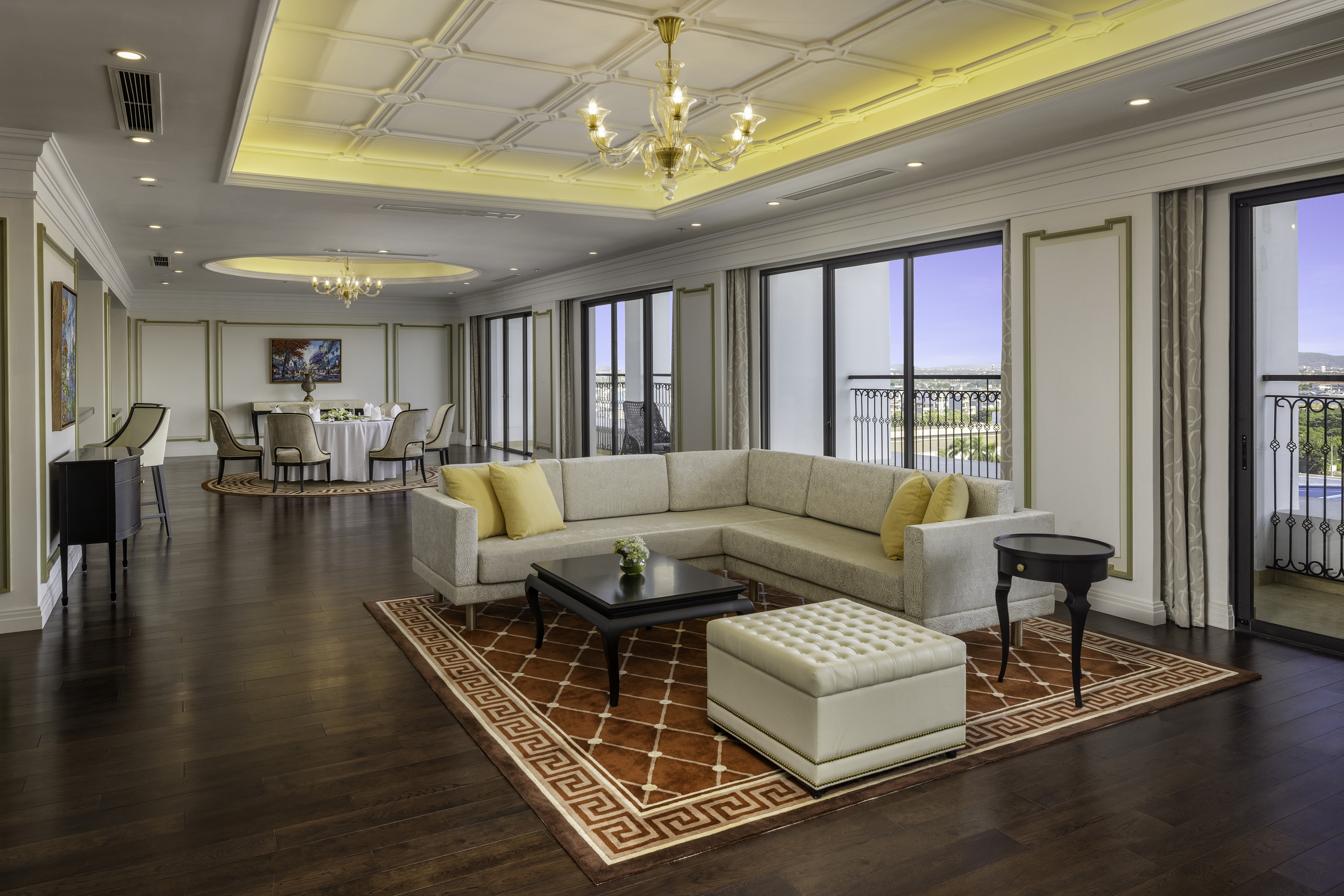 Modern luxury living room and dining area with balcony, elegant decor.