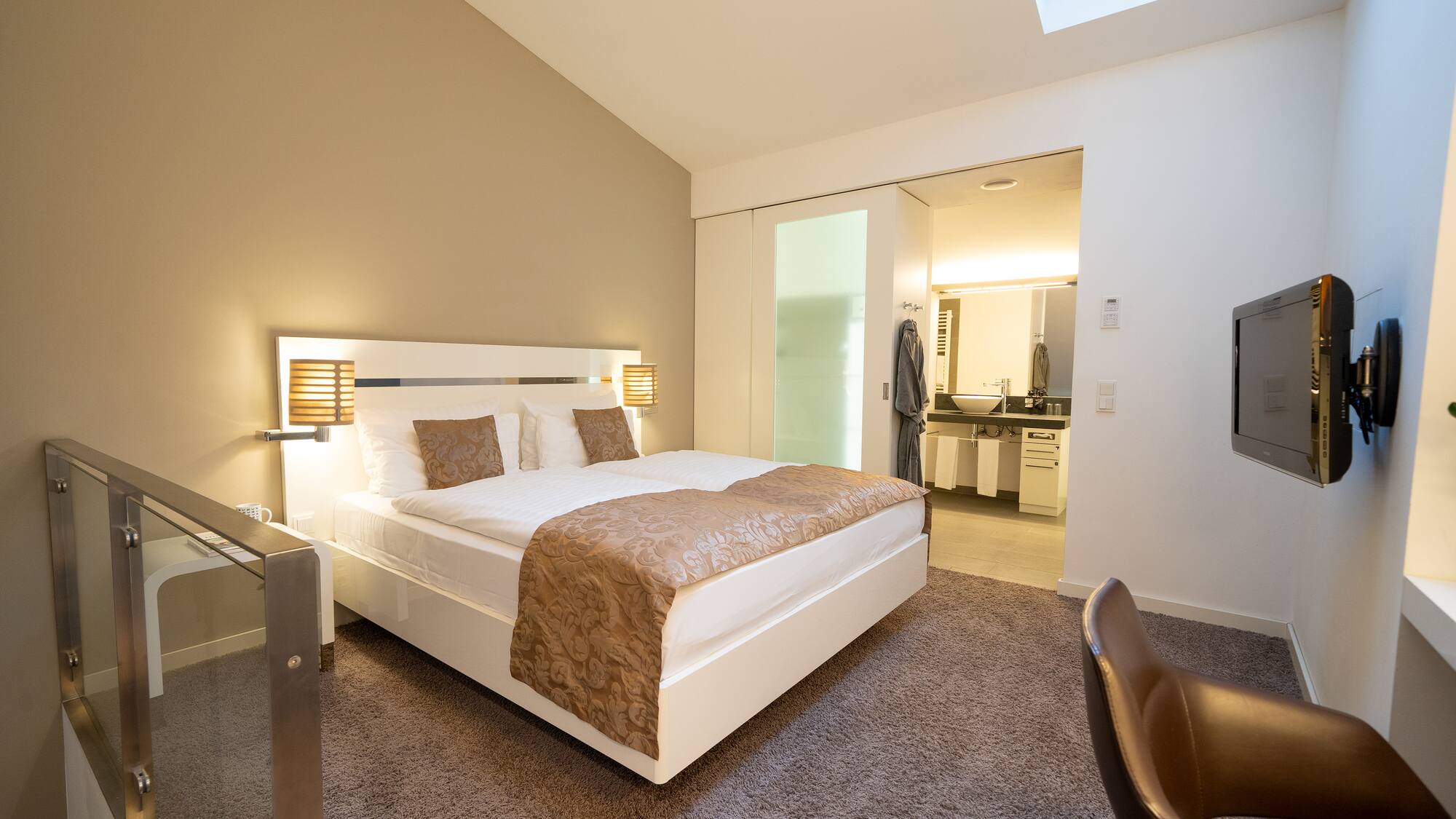 a bedroom with a bed and a glass door