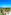 Luxury tropical resort with pools, palm trees, modern architecture, and ocean.