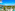 Luxury tropical resort with pools, palm trees, modern architecture, and ocean.