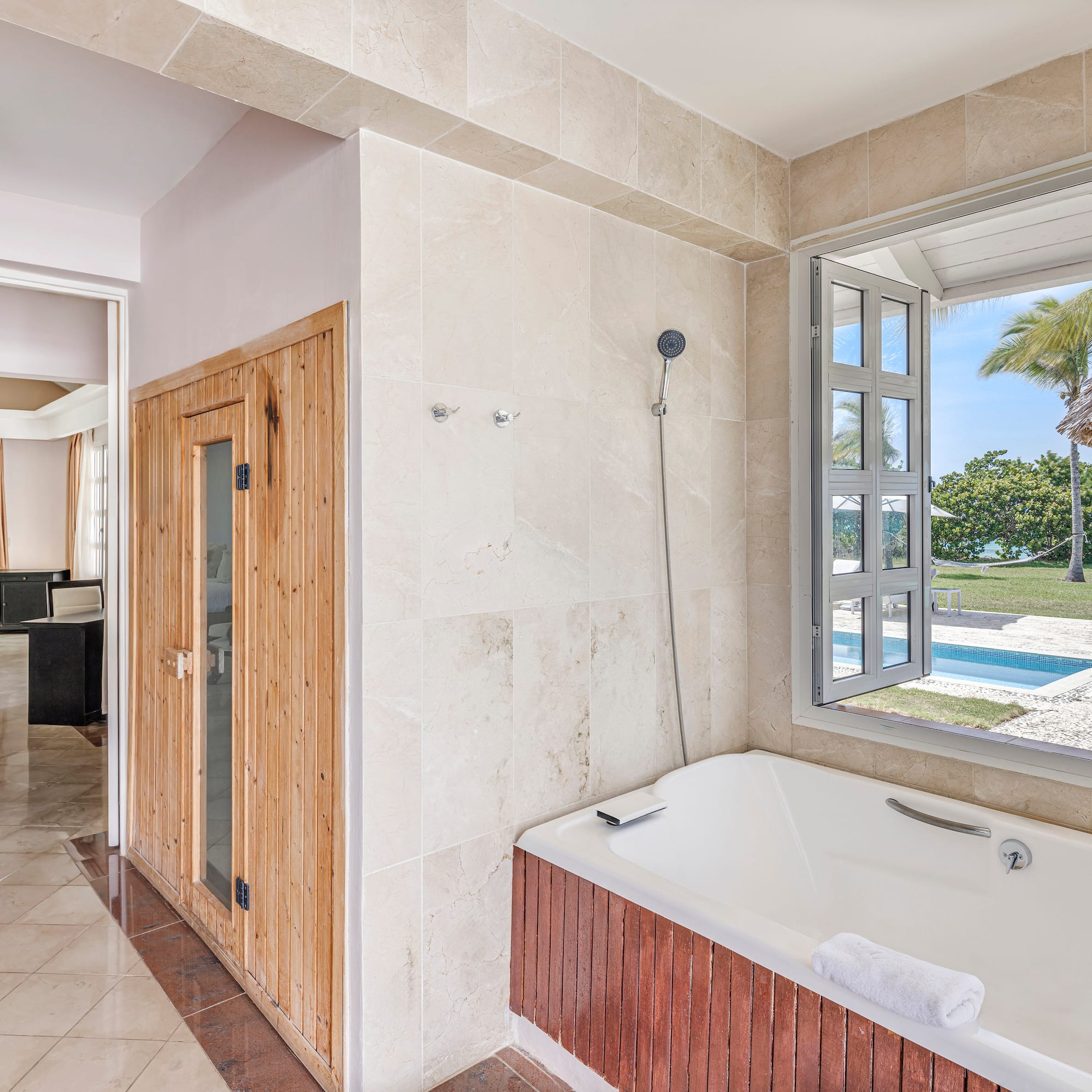 a bathroom with a tub and a window