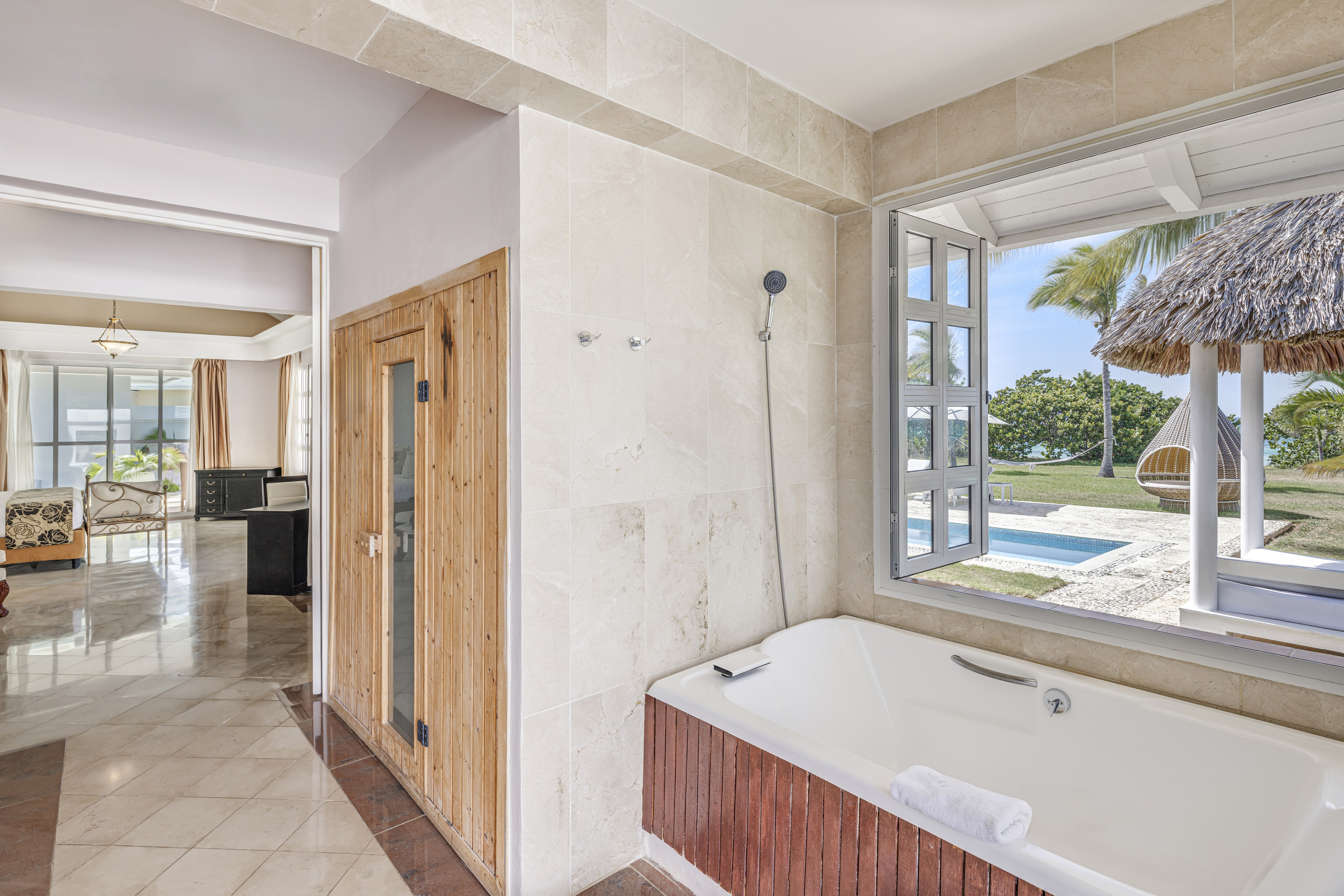 a bathroom with a tub and a window