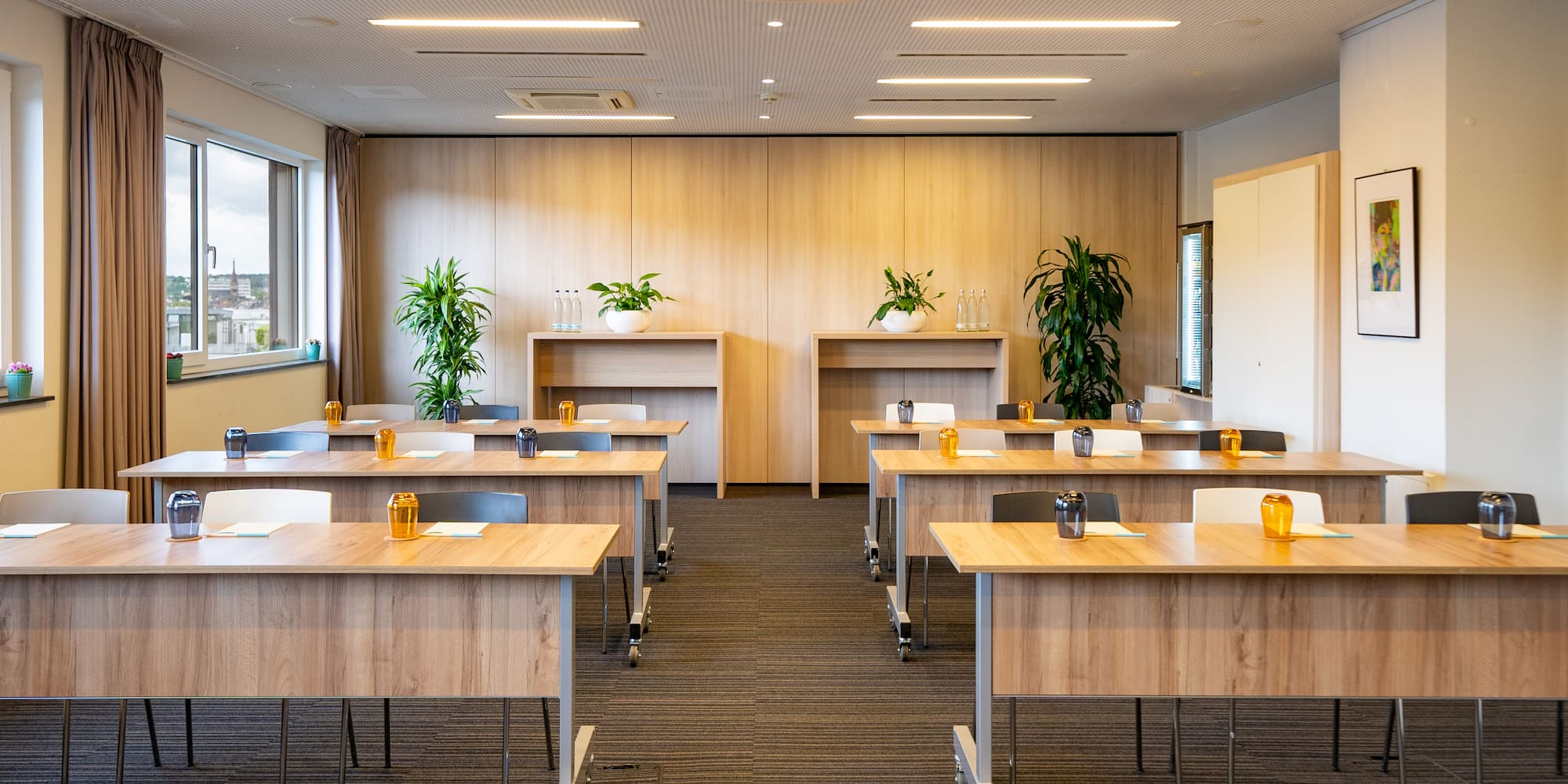 a room with tables and plants