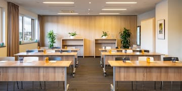 a room with tables and plants