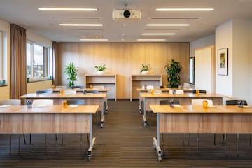 a room with tables and plants