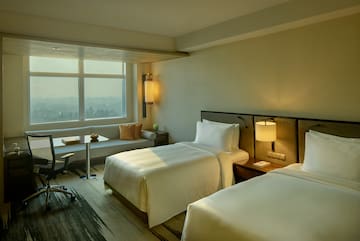 a room with two beds and a table