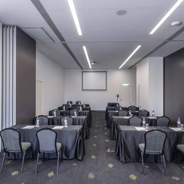 a room with tables and chairs