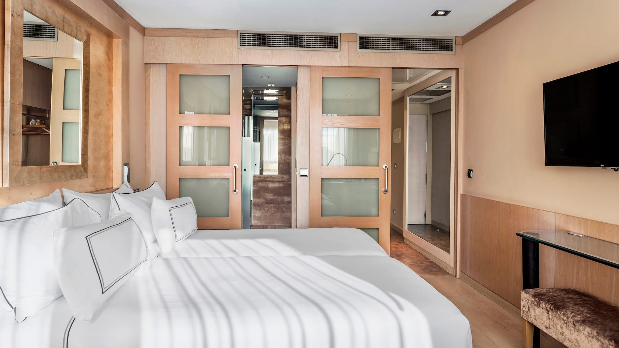 a room with two beds and a door