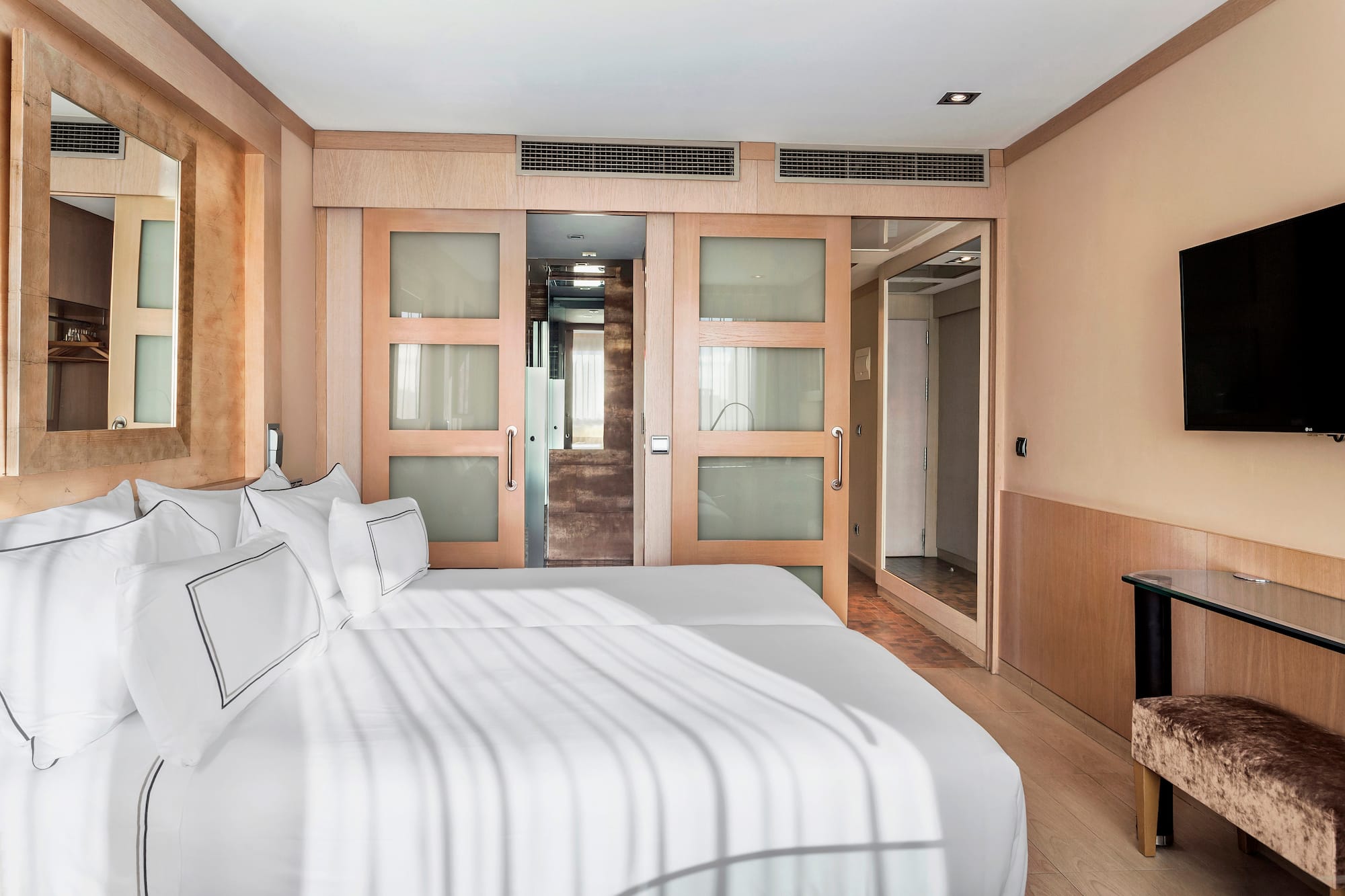 a room with two beds and a door