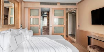 a room with two beds and a door