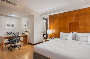 a room with a bed and a desk