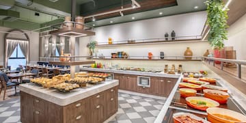 a large kitchen with food on the counter