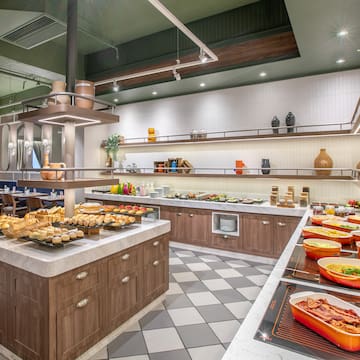 a large kitchen with food on the counter