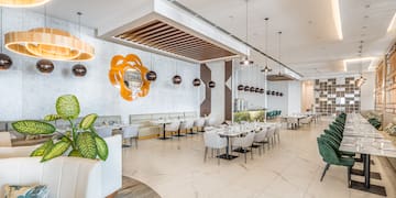 a restaurant with tables and chairs