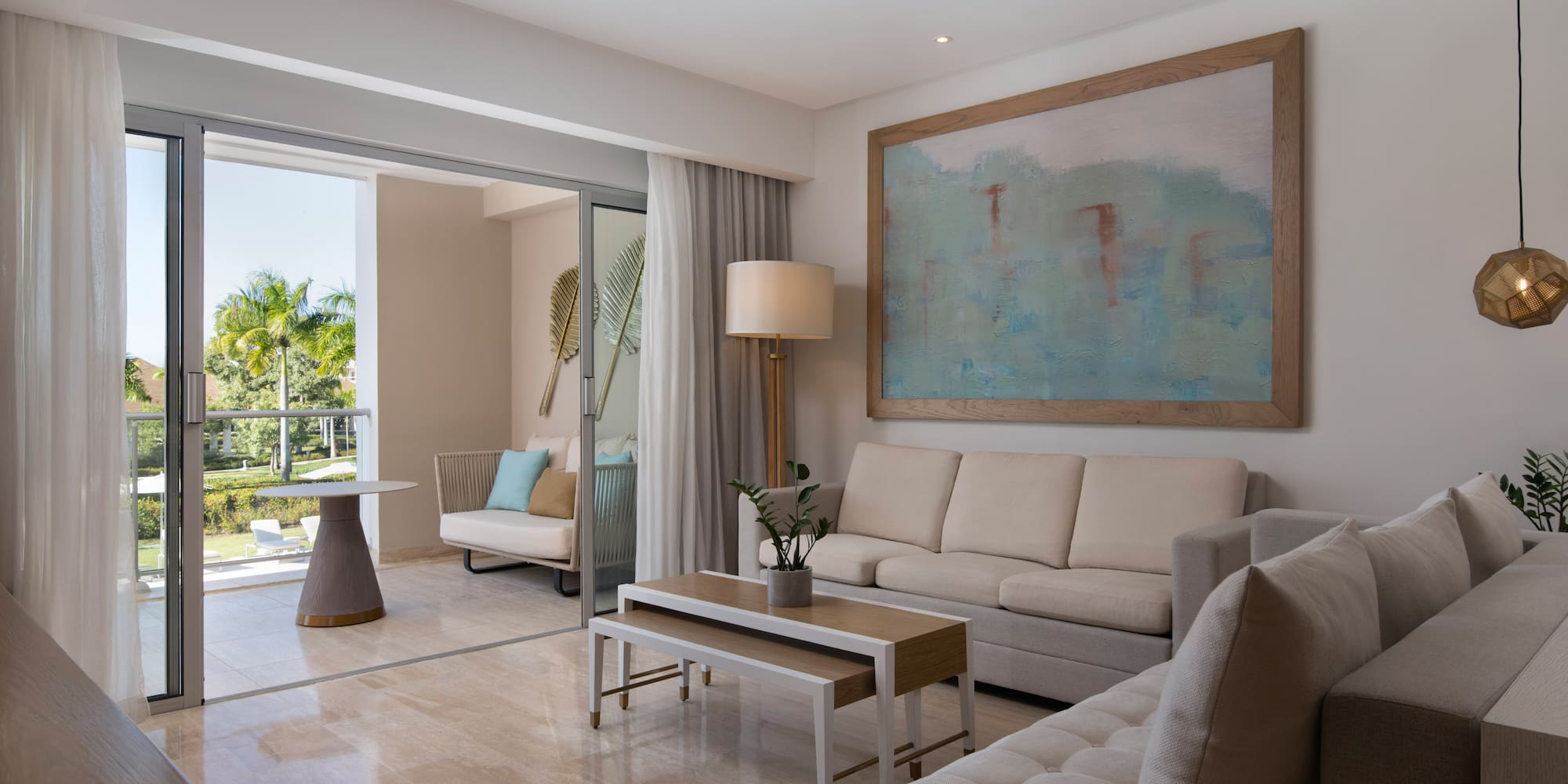 a living room with a large painting on the wall