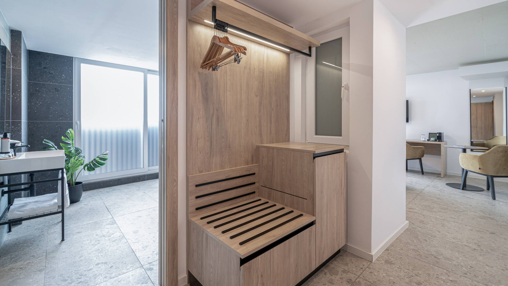 a wooden bench in a hallway