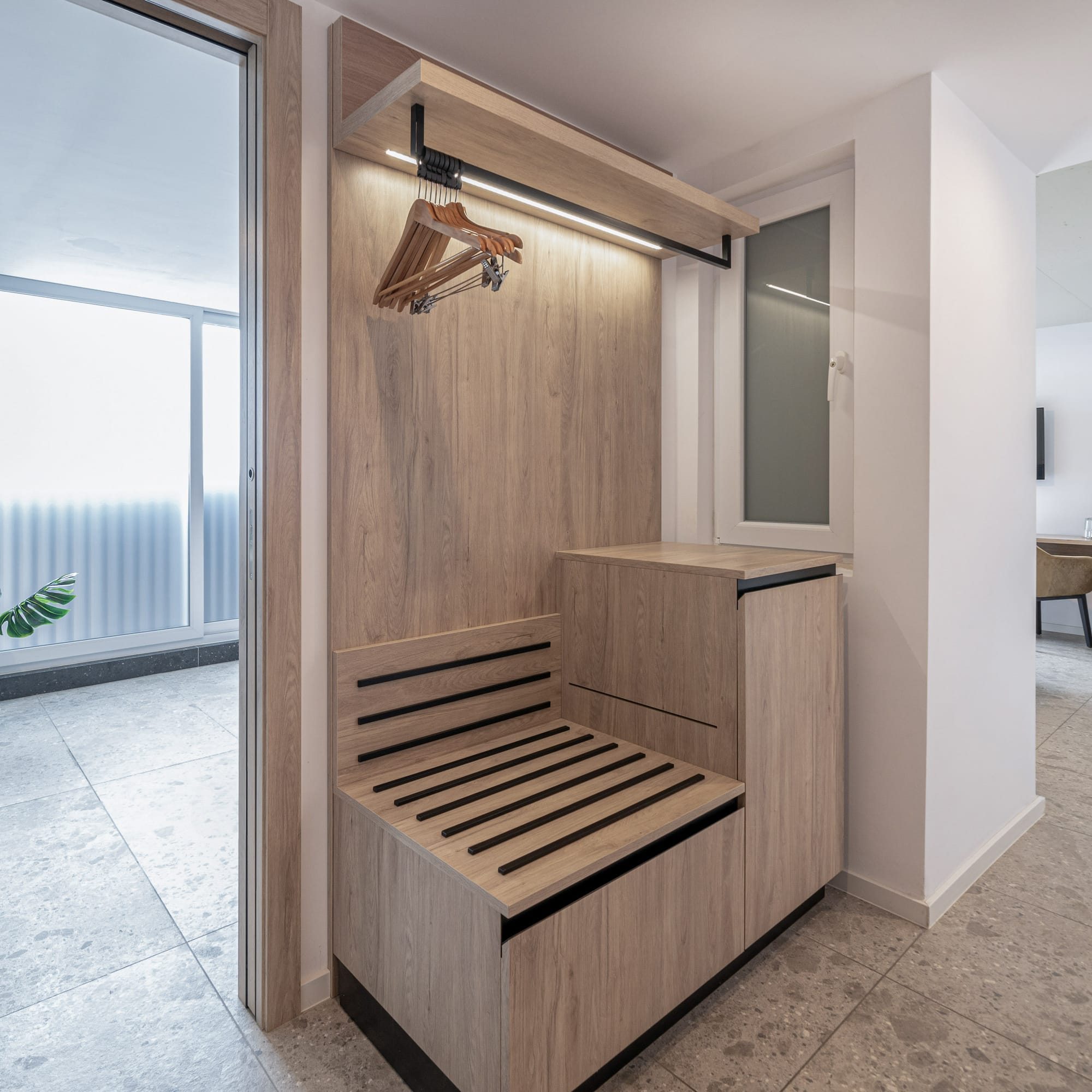 a wooden bench in a hallway