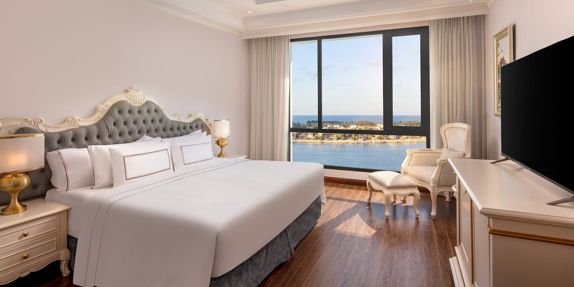 a room with a large window and a bed