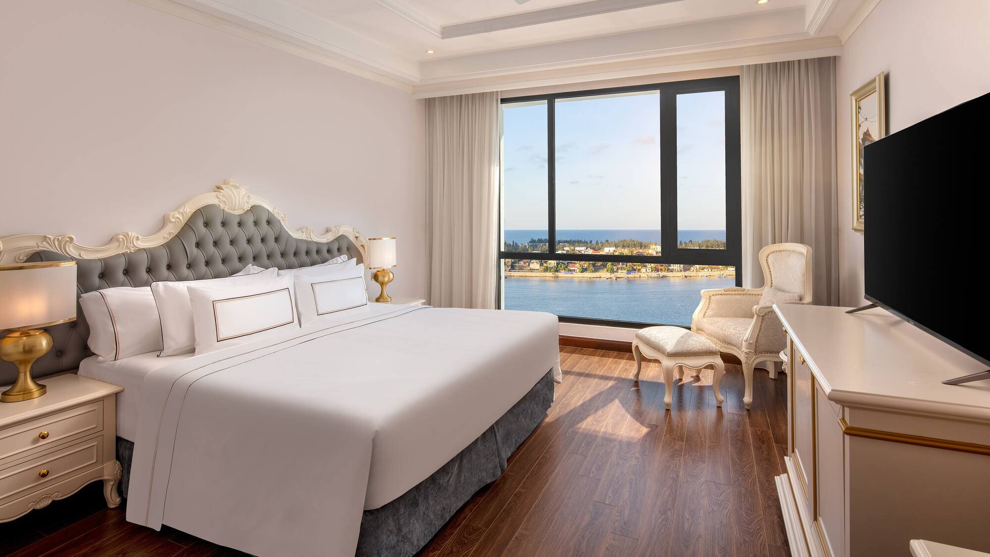 a room with a large window and a bed