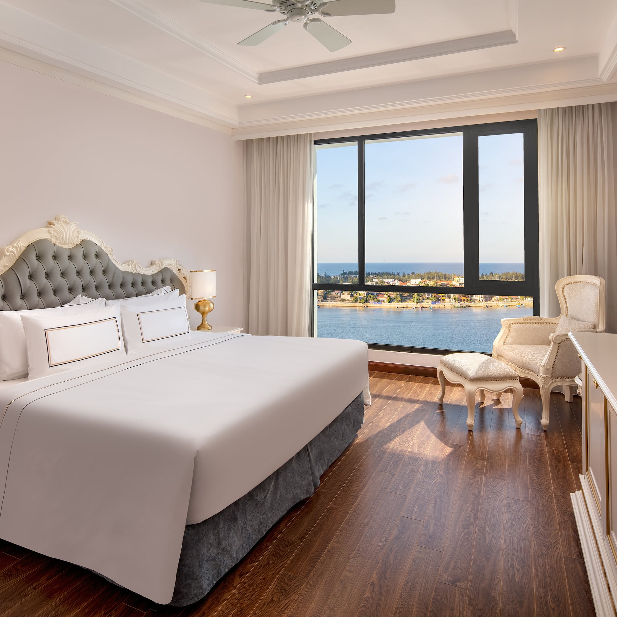 a room with a large window and a bed