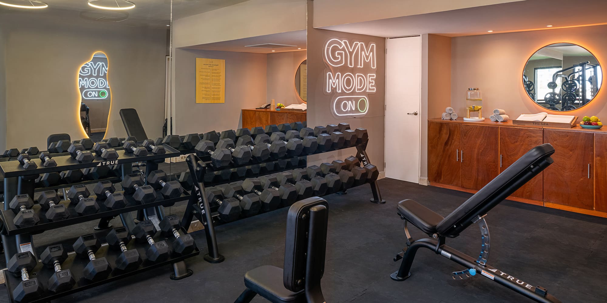 a room with weights and a mirror