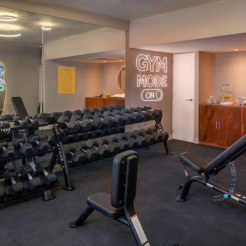 a room with weights and a mirror