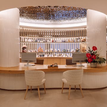 a counter with chairs in front of it