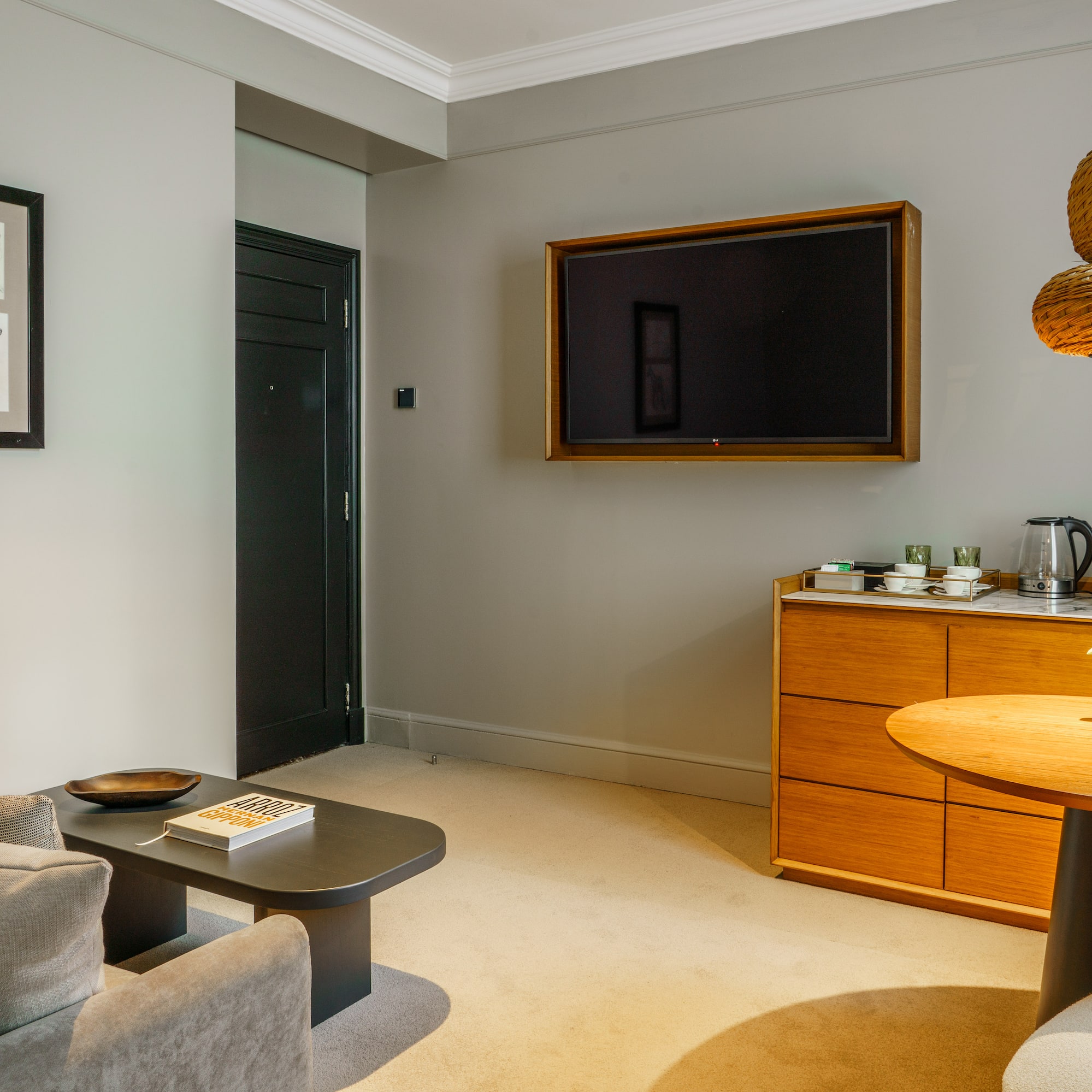 a living room with a tv on the wall