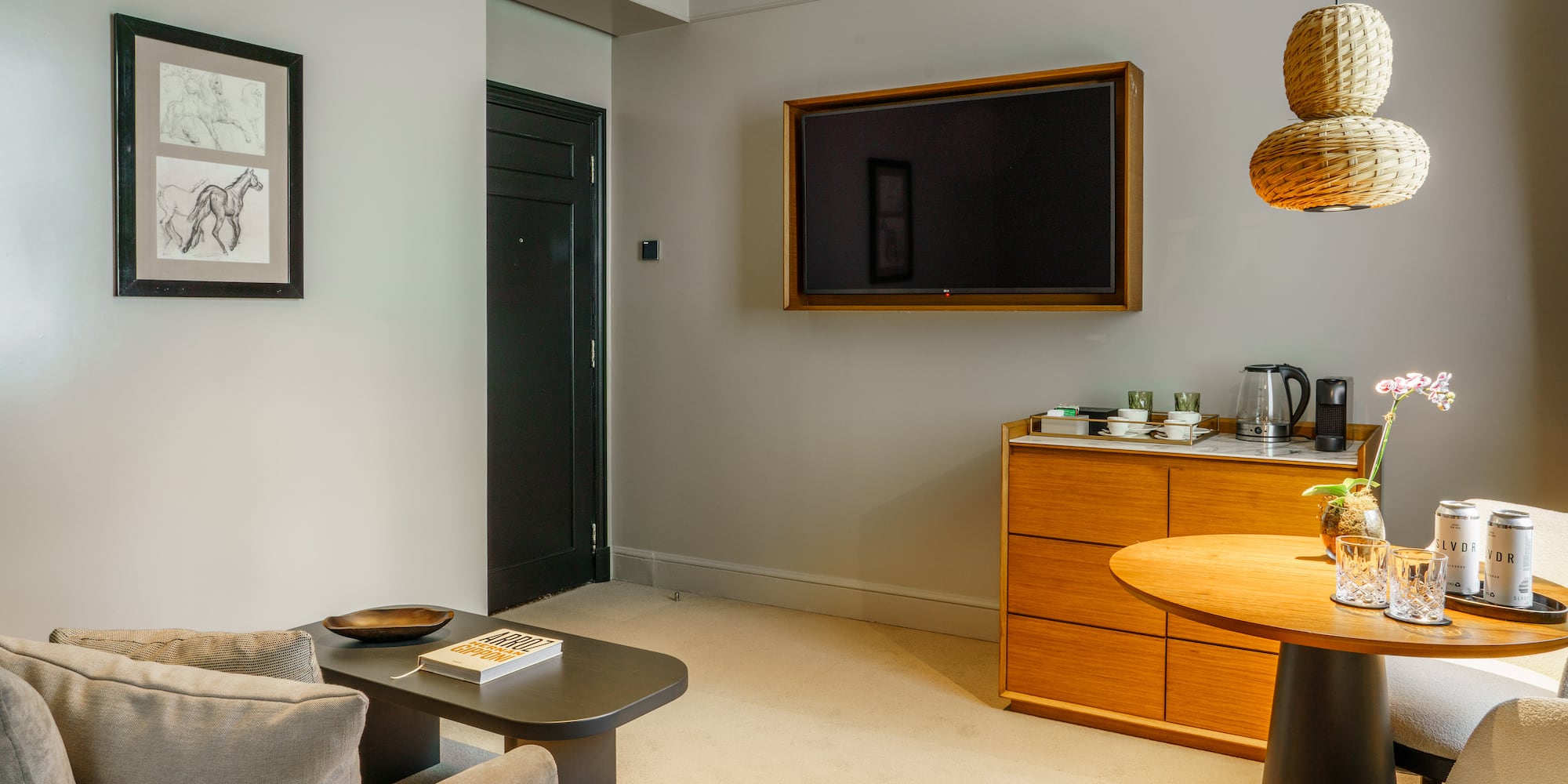 a living room with a tv on the wall