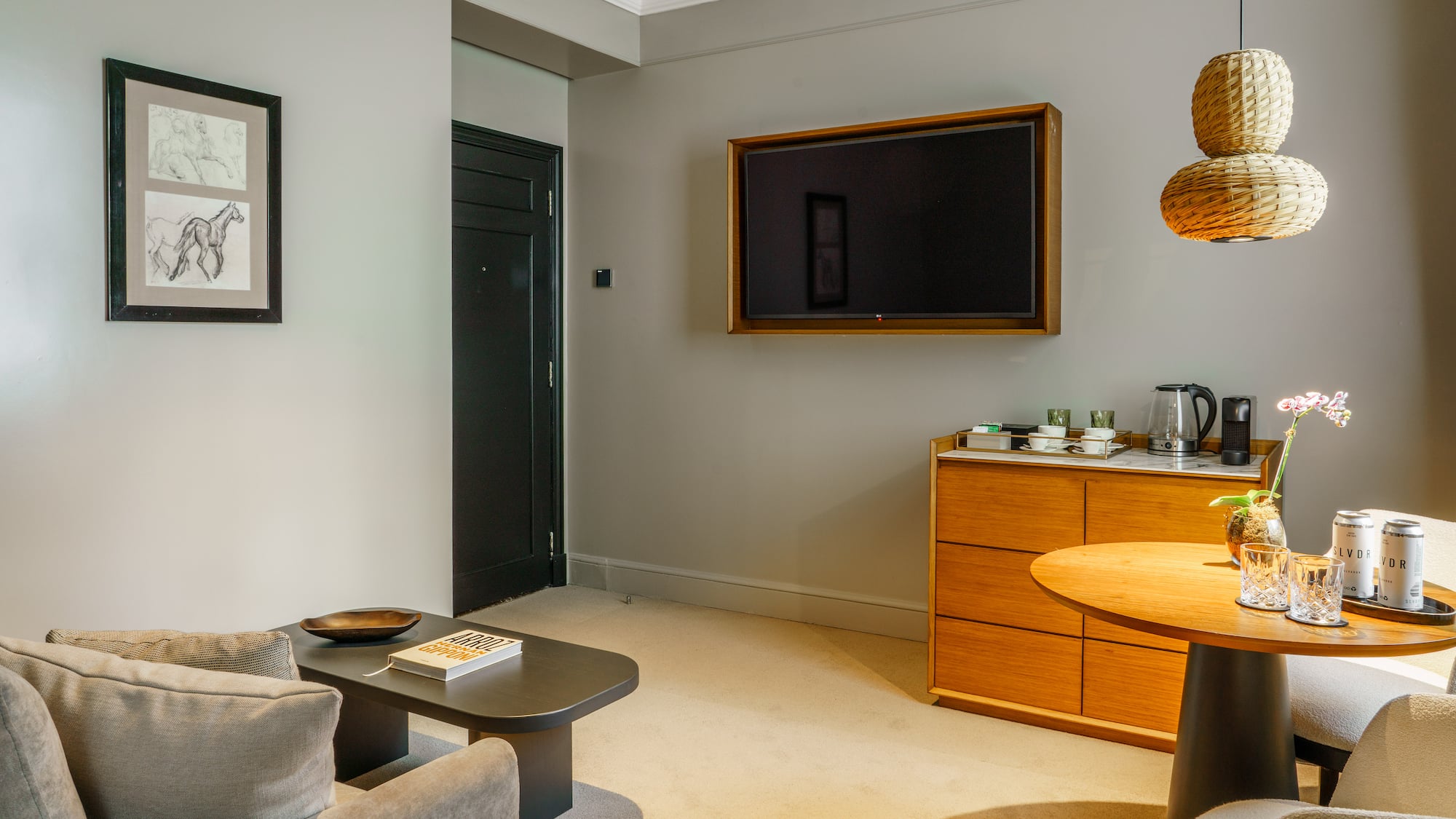 a living room with a tv on the wall