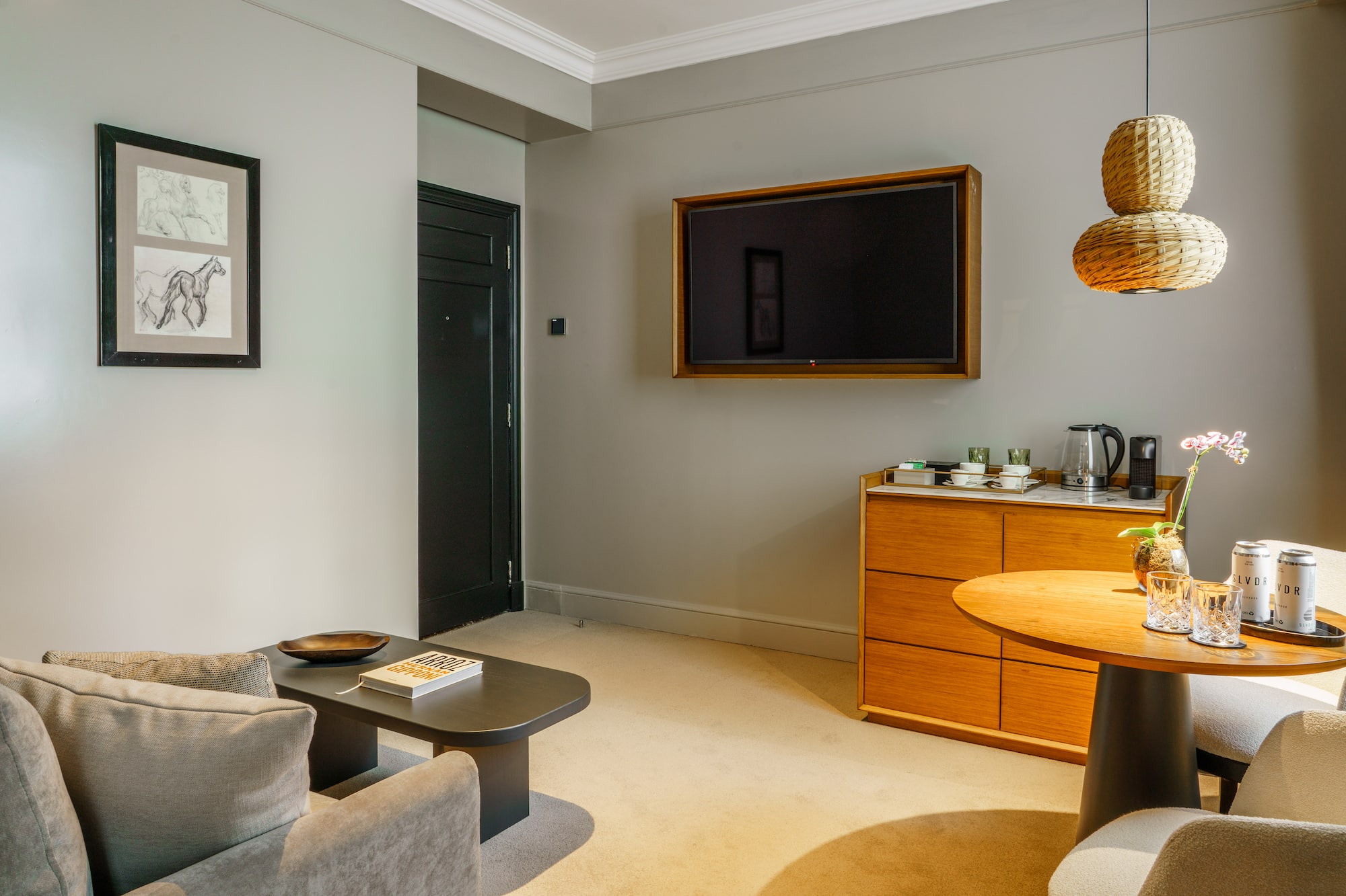 a living room with a tv on the wall