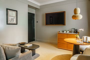 a living room with a tv on the wall