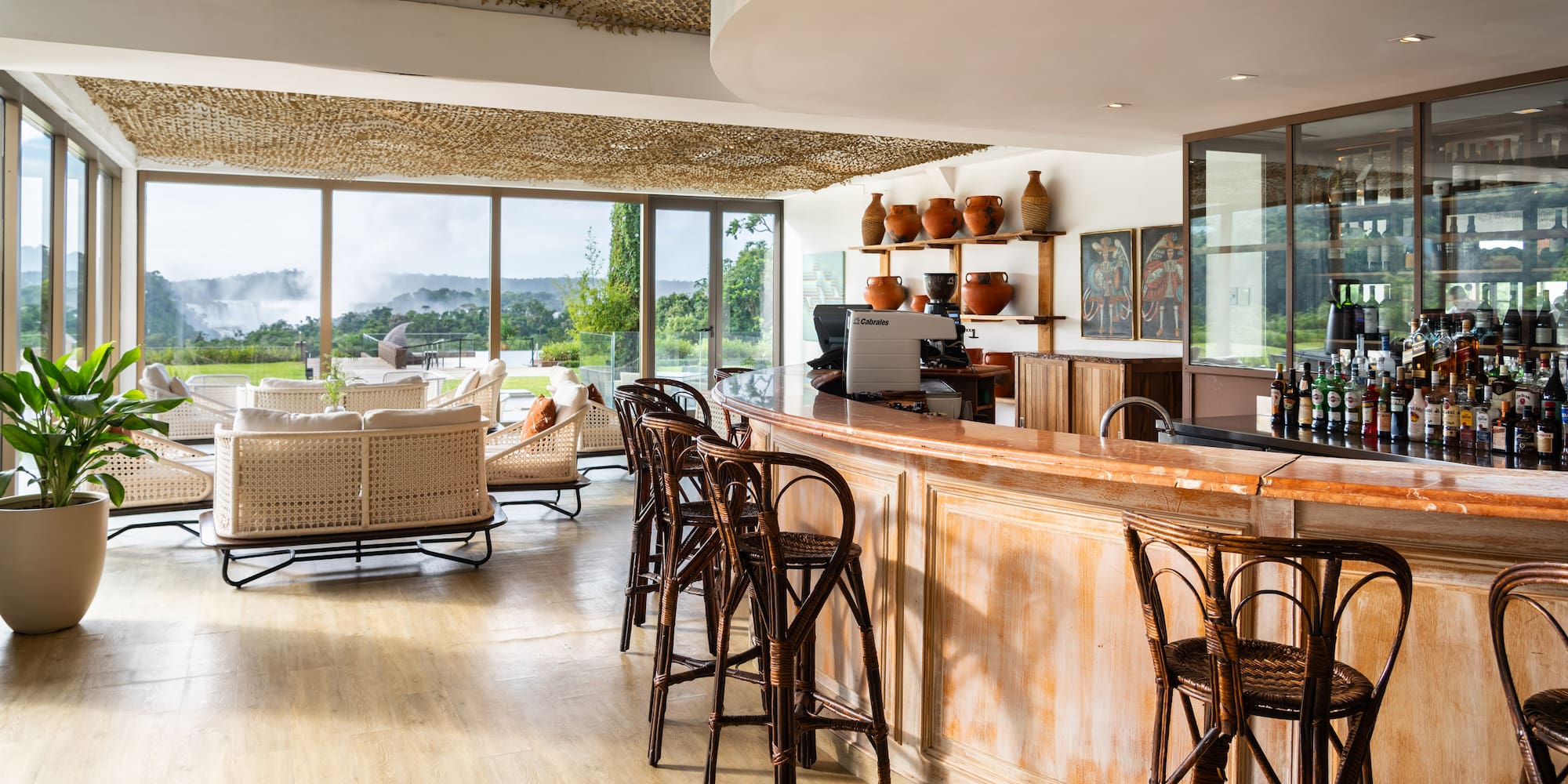 a room with a bar and chairs